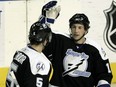 Former Tampa Bay Lightning winger Rob DiMaio (right) celebrates a goal in 2005.