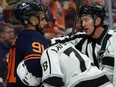 The Edmonton Oilers' Evander Kane (91) holds the Los Angeles Kings' Alex Laferriere (78) in a headlock during third period NHL action at Rogers Place in Edmonton Thursday March 28, 2024. The Oilers won 4-1.