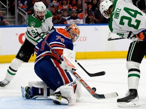 The Edmonton Oilers' goalie Stuart Skinner (74) battles the Dallas Stars' Tyler Seguin (91) and Roope Hintz (24) during second period NHL playoff action at Rogers Place, in Edmonton Monday May 27, 2024. Photo by David Bloom