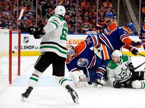 The Dallas Stars' Wyatt Johnston (53) scores on the Edmonton Oilers' goalie Stuart Skinner (74) during second period NHL playoff action at Rogers Place, in Edmonton Monday May 27, 2024.