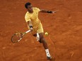 Montreal's Félix Auger-Aliassime returns the ball to Russia's Andrey Rublev during the Madrid Open final at Caja Magica on Sunday.