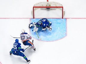 VANCOUVER, CANADA - MAY 10: Connor McDavid #97 of the Edmonton Oilers scores a goal against Arturs Silovs #31 of the Vancouver Canucks during the third period in Game Two of the Second Round of the 2024 Stanley Cup Playoffs at Rogers Arena on May 10, 2024 in Vancouver, British Columbia, Canada.