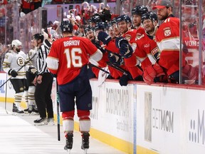 Aleksander Barkov, left, of the Florida Panthers high-fives teammates after scoring a goal during the second period against the Boston Bruins in Game 2 of the Second Round of the 2024 Stanley Cup Playoffs at Amerant Bank Arena on Wednesday, May 8, 2024, in Sunrise, Fla.