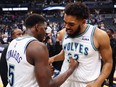 Karl-Anthony Towns, right, and Anthony Edwards of the Minnesota Timberwolves react after winning Game 7 of the Western Conference Second Round Playoffs against the Denver Nuggets at Ball Arena on May 19, 2024 in Denver, Colo.
