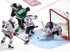DALLAS, TEXAS - MAY 23: Stuart Skinner #74 of the Edmonton Oilers makes a save against Tyler Seguin #91 of the Dallas Stars during overtime in Game One of the Western Conference Final of the 2024 Stanley Cup Playoffs at American Airlines Center on May 23, 2024 in Dallas, Texas.