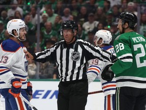 Mattias Janmark (13) of the Edmonton Oilers argues with Alexander Petrovic (28) of the Dallas Stars in Game 2 of the Western Conference final at American Airlines Center on May 25, 2024, in Dallas.