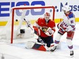 Alex Wennberg of the New York Rangers scores the game winning goal against Sergei Bobrovsky of the Florida Panthers during overtime in Game 3 of the Eastern Conference Final of the 2024 Stanley Cup Playoffs at Amerant Bank Arena on May 26, 2024 in Sunrise, Fla.