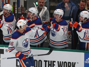 Philip Broberg of the Edmonton Oilers celebrates with his bench after scoring a goal against the Dallas Stars during the first period in Game Five of the Western Conference Final of the 2024 Stanley Cup Playoffs at American Airlines Center on May 31, 2024 in Dallas, Texas.