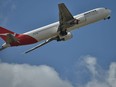 A Qantas plane takes off at an airport on Aug. 28, 2014, in Sydney, Australia.