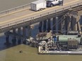Oil spills into the surrounding waters after a barge hit a bridge in Galveston, Texas, on Wednesday, May 15, 2024. A bridge that leads to Pelican Island, located just north of Galveston, was hit by a barge around 9:30 a.m., said Ronnie Varela, with the Galveston’s Office of Emergency Management.