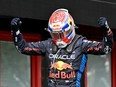 Red Bull Racing driver Max Verstappen celebrates after winning the Emilia Romagna Formula One Grand Prix at the Autodromo Enzo e Dino Ferrari race track in Imola on May 18, 2024