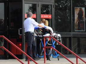 A stretcher is wheeled into an AMC movie theatre in Braintree, Mass., on Saturday, May 25, 2024.