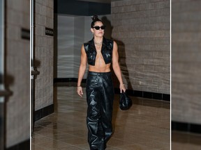 The Las Vegas Aces guard Kelsey Plum went shirtless under a cropped leather vest and wore matching black pants by Alexander Wang.