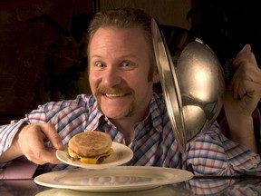 Filmmaker Morgan Spurlock poses with an 'Egg McMuffin'.