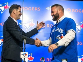 Blue Jays general manager Ross Atkins (left) and manager John Schneider in far happier times. Will either of them survive this disappointing start to the season?  Ernest Doroszuk/Toronto Sun file