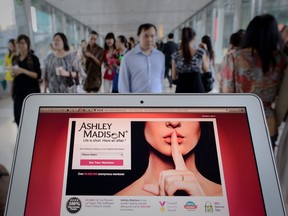 This file illustration taken on Aug. 20, 2013 shows the homepage of the Ashley Madison dating website displayed on a laptop in Hong Kong.