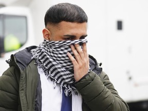 West Yorkshire Police officer Mohammed Adil, 26, leaves Westminster Magistrates' Court in central London, Thursday May 2, 2024, after he admitted two counts of publishing an image in support of Hamas, which is banned and designated a terror group in the U.K., the Independent Office for Police Conduct said.