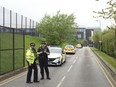 Police stand outside the Birley Academy in Sheffield, northern England, on Wednesday, May 1, 2024.