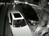 A screengrab from home surveillance video released by Toronto Police early in 2022 shows carjackers backing out of a driveway as two victims look on with a stolen vehicle.
