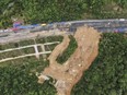 In this aerial photo released by Xinhua News Agency, rescue workers at the site of a collapsed section of a highway on the Meizhou-Dabu Expressway in Meizhou, southern China's Guangdong Province on May 2, 2024.