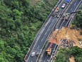 In this photo released by Xinhua News Agency, an aerial photo shows rescuers work at the site of a collapsed road section of the Meizhou-Dabu Expressway in Meizhou, south China's Guangdong Province, Wednesday, May 1, 2024.