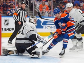 Derek Ryan (10) of the Edmonton Oilers, tries to shovel the puck past goalie David Rittich (31) of the Los Angeles Kings at Rogers Place in Edmonton on May 1, 2024.
