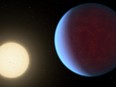 This illustration provided by NASA in 2017 depicts the planet 55 Cancri e, right, orbiting its star.