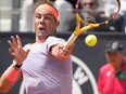 Rafael Nadal, of Spain, returns the ball to Hubert Hurkacz, of Poland, during their match at the Italian Open tennis tournament in Rome, Saturday, May 11, 2024.