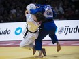 Defending champion Christa Deguchi settled for silver at the world judo championships Monday. Deguchi (white) and Sumiya Dorjusren of Mongolia (blue) compete during the women's 57-kg final match at the Grand Slam Paris 2020 Judo tournament, in Paris, France, Saturday, Feb. 8, 2020.
