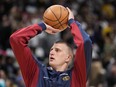Denver Nuggets centre Nikola Jokic warms up prior to Game 1 of an NBA basketball first-round playoff game against the Los Angeles Lakers, Saturday, April 20, 2024, in Denver.