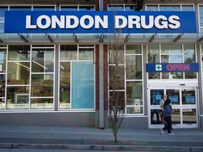 People wait outside of the London Drugs Dunbar location on Monday, April. 29, 2024. Retailer London Drugs says it is "unwilling and unable" to pay a multimillion-dollar ransom to cybercriminals who claim to have stolen data in a hacking attack that recently shut down its stores for more than a week.