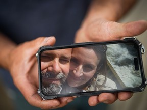 Jason Gaudreault, whose partner Tatjana Stefanski was found dead on April 14 after disappearing a day earlier, shows a photograph of them on his phone, in Lumby, B.C., on Monday, May 13, 2024.