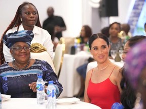 Meghan, the Duchess of Sussex, right, sits by Ngozi Okonjo-Iweala, Director-General of the World Trade Organization, during an event in Abuja, Nigeria, Saturday, May 11, 2024.