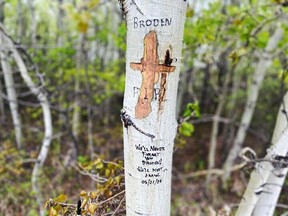 A memorial was carved on a tree where Broden Radomske was fatally injured on Tuesday, May 21, 2024, while walking a dog with his mother.