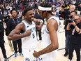 Anthony Edwards #5 and Jaden McDaniels #3 of the Minnesota Timberwolves celebrate after winning Game Seven of the Western Conference Second Round Playoffs against the Denver Nuggets at Ball Arena on May 19, 2024 in Denver, Colorado.