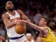 Alec Burks of the New York Knicks attempts a shot while being guarded by T.J. McConnell of the Indiana Pacers at Madison Square Garden on May 19, 2024 in New York.