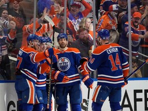 Edmonton Oilers' Ryan Nugent-Hopkins (93) celebrates a goal with teammates against the Vancouver Canucks' during second period, second-round NHL playoff action in Edmonton on Tuesday, May 14, 2024 in Edmonton.