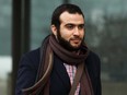 Omar Khadr leaves Court of Queen's Bench in Edmonton, on Monday, March 25, 2019 after a judge declared his sentence expired.