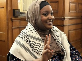 Sarah Jama, an independent MPP, speaks to members of the media while wearing keffiyeh at Queen's Park in Toronto on Tuesday April 23, 2024.
