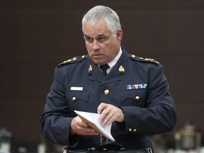 Acting RCMP Commissioner Mike Duheme waits to appear before the Procedure and House Affairs committee, in Ottawa, Tuesday, June 13, 2023.
