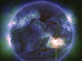 This image provided by NASA shows a solar flare, as seen in the bright flash in the lower right, captured by NASA's Solar Dynamics Observatory on May 9, 2024.