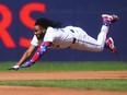 Vladimir Guerrero Jr. of the Toronto Blue Jays slides into second base on a double against the Tampa Bay Rays on Saturday.
