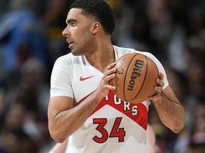 BANNED FROM THE NBA: Toronto Raptors' Jontay Porter holds the ball during a game earlier this year.