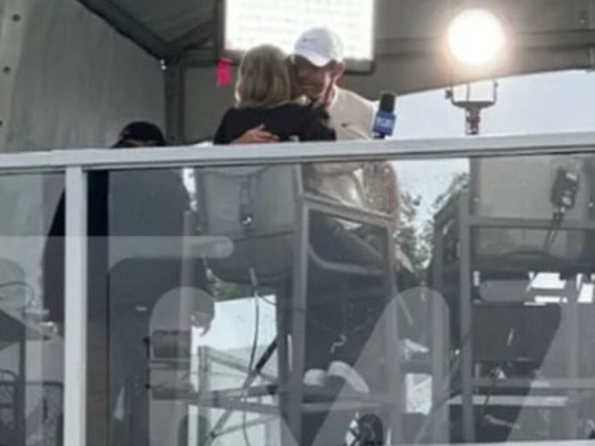 Rory McIlroy hugs Amanda Balionis during an interview at the Canadian Open.