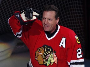 Former Chicago Blackhawks player Jeremy Roenick acknowledges the crowd after being honored before an NHL hockey game between the Vancouver Canucks and the Blackhawks in 2017.