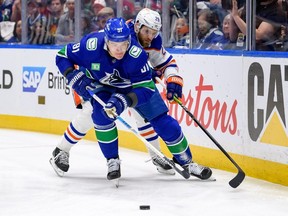 Edmonton Oilers' Leon Draisaitl #29 checks Nikita Zadorov #91 of the Vancouver Canucks during the first period in Game 7 of the Second Round of the 2024 Stanley Cup Playoffs at Rogers Arena on May 20, 2024 in Vancouve.