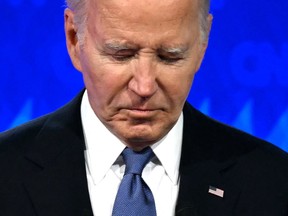 U.S. President Joe Biden looks down as he participates in the first presidential debate of the 2024 elections with former U.S. President and Republican presidential candidate Donald Trump at CNN's studios in Atlanta on June 27, 2024.