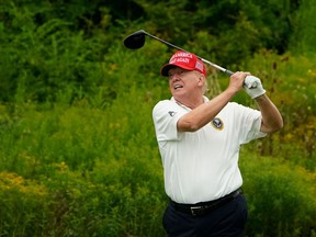 Former US President and 2024 Presidential hopeful Donald Trump plays golf during the Official Pro-Am Tournament ahead of the LIV Golf Invitational Series event at Trump National Golf Club Bedminster in Bedminster, New Jersey, on August 10, 2023.