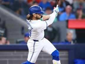 Blue Jays batter Bo Bichette hits a double in the fifth inning against the Yankees at Rogers Centre in Toronto, Saturday, June 29, 2024.