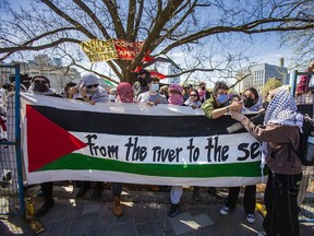 The entrance to a Pro-Palestinian encampment in an area that was fenced off at the University of Toronto campus in downtown Toronto on Thursday, May 2, 2024.